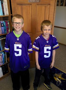 A couple brothers supporting their favorite football team and visiting Pastor Nick's office.